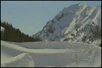 Snowboarder jumps into the snow