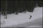 Snowboarder jumps over a Surburban