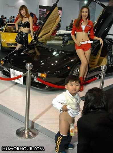 Kid looking at a car